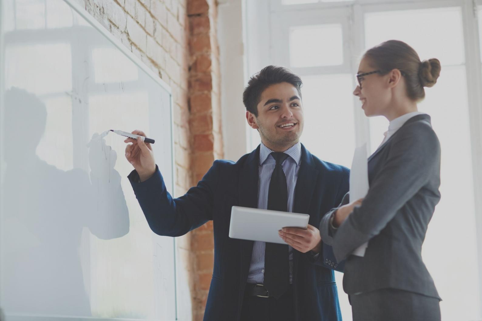 Financial analyst reviewing technical requirements and system specifications